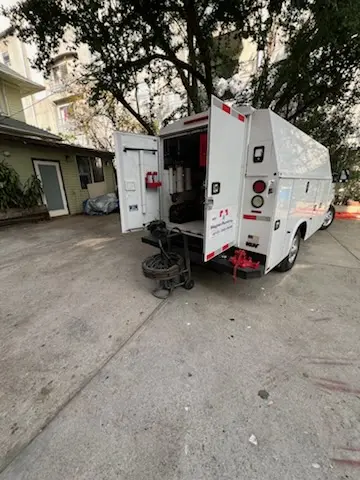 Magnet Plumbing service vehicle on-site for Grease Trap Cleaning in Rockwell